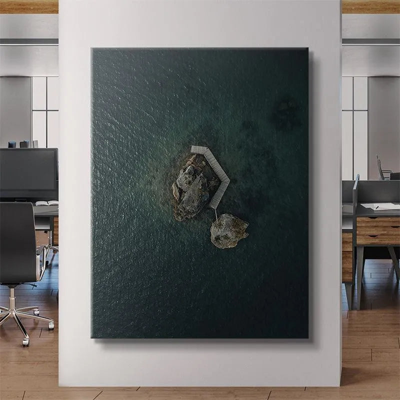 Moody lighting angle highlighting the solitary nature of the 'Lonely Rock' composition on the water.