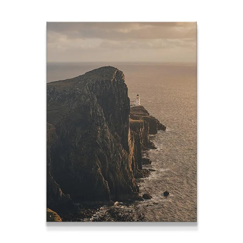Vertical view of the Lonesome Lighthouse situated on dark, dramatic ocean cliffs at sunset.