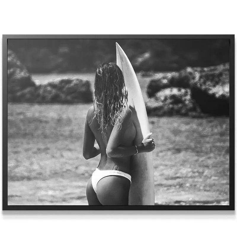 Black and white 'Lost Top' showing the back angle and white bikini bottoms by the surf.