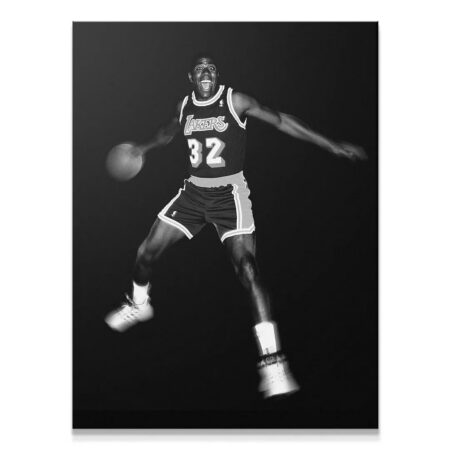 Full-body action shot of Magic Johnson - It's Magic jumping in his Lakers #32 uniform.
