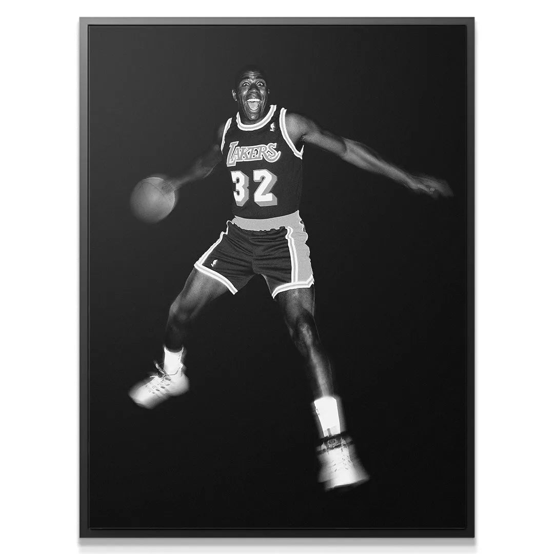 High-contrast close-up of the excited face and smile of Magic Johnson - It's Magic during play.