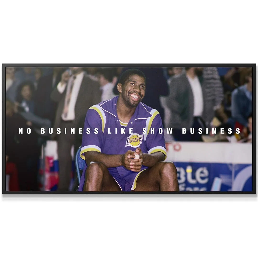 Close-up portrait emphasizing the charismatic smile in the Magic Johnson - Show Business photo.