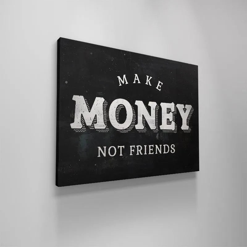 Lifestyle photo of an entrepreneur working in a loft apartment with the large 'Make Money Not Friends' print prominently featured.