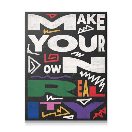 Full view of the motivational typographic print, "Make Your Own Reality," featuring distressed white and colorful lettering.