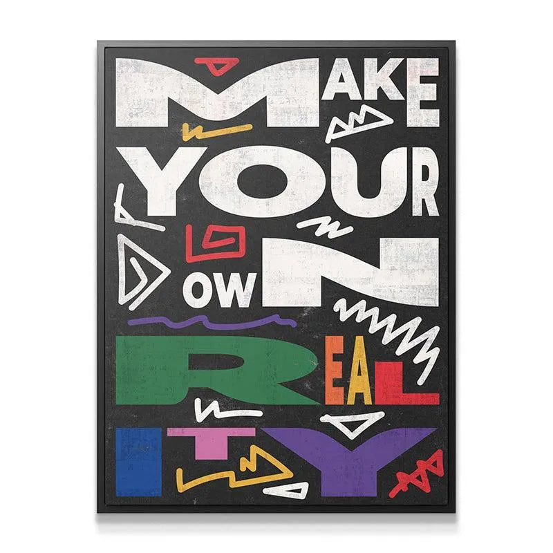 Close-up detail showing the textured, chalk-like finish of the "Make Your Own Reality" quote on black canvas.