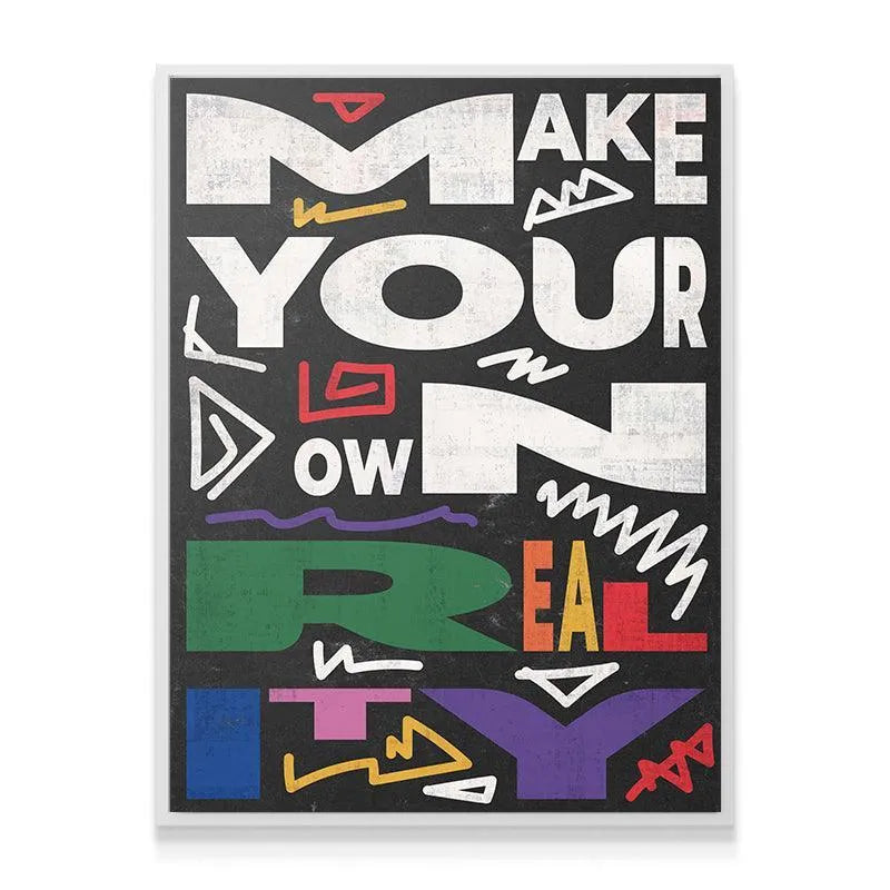 Lifestyle shot of the vibrant "Make Your Own Reality" poster hanging in a modern home office setting.