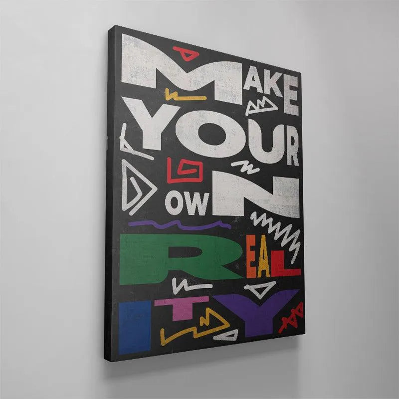 Detailed crop showing the green and orange color blocks forming the 'REAL' section of the "Make Your Own Reality" artwork.
