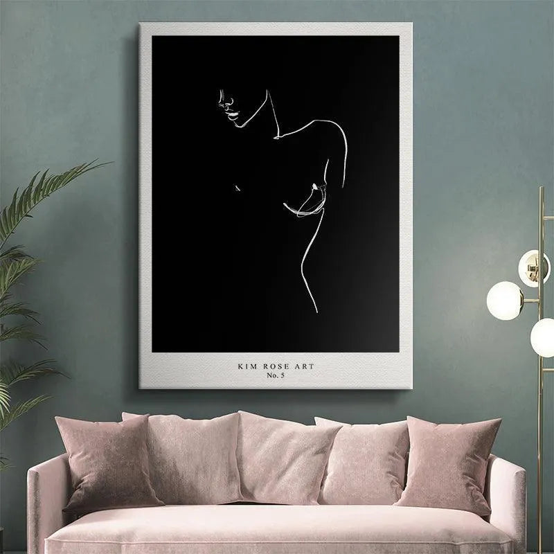 Lifestyle shot: Mathild - Black poster displayed above a modern wooden sideboard in a living room setting.