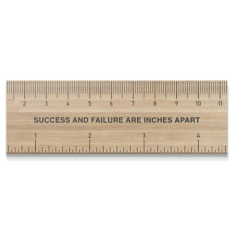 Full overhead view of the wooden 'Measure Of Success' ruler on a clean white background.