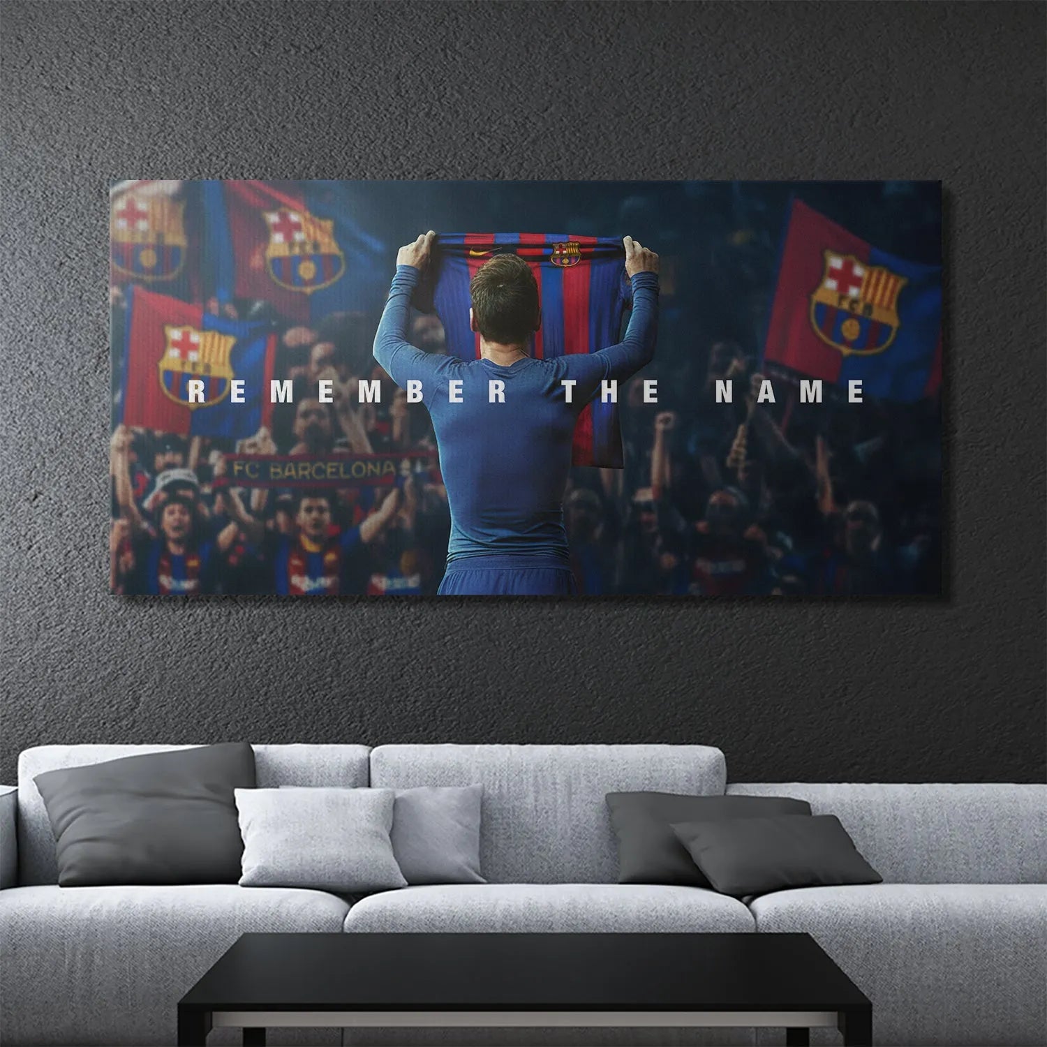 Close view focusing sharply on the striking white text overlay 'Messi - Remember The Name' on the image.