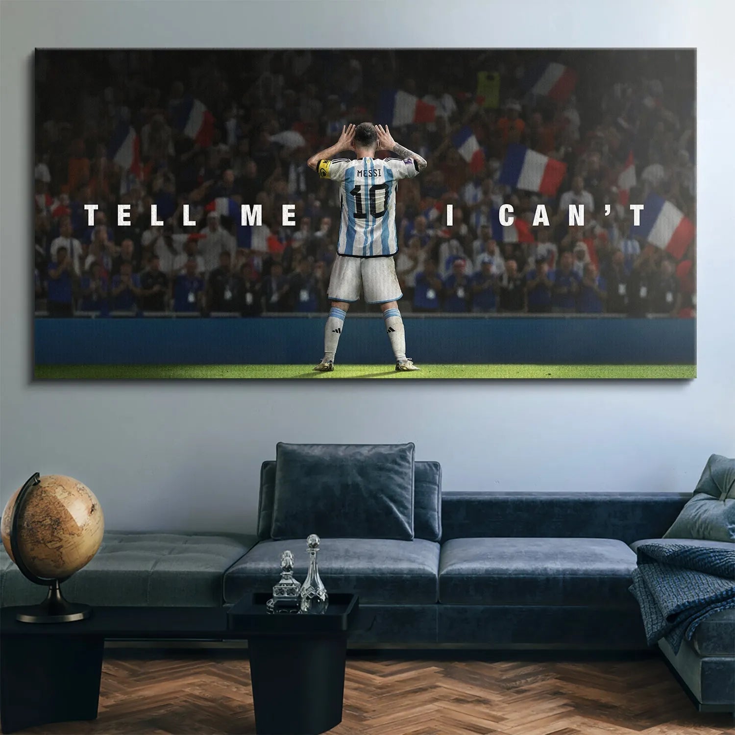 Lifestyle mock-up showing the framed canvas 'Messi - Tell Me I Can't' displayed prominently in a modern office space.