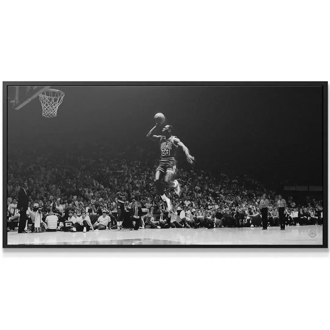 Close-up of Michael Jordan - Elevation focusing on the intensity of his face and the basketball texture.