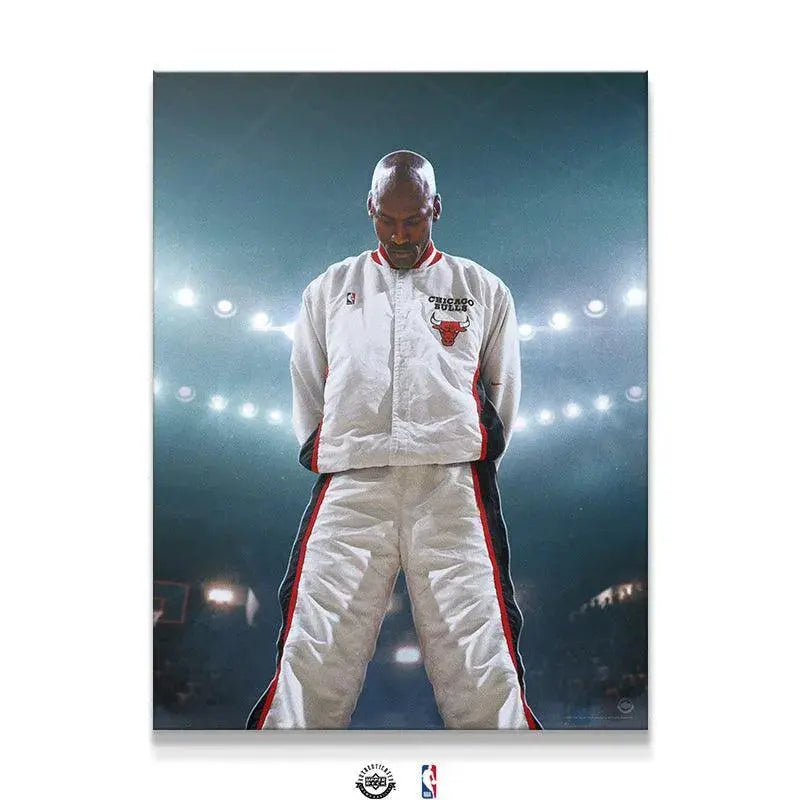 Full body shot of Michael Jordan - Encore standing solemnly in white Bulls warm-up suit.