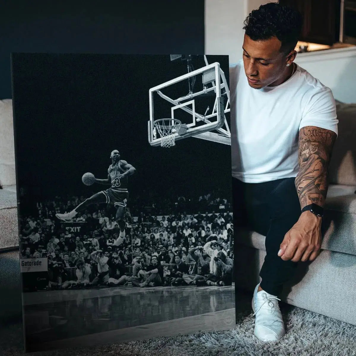 Lifestyle view of the vertical canvas print titled Michael Jordan - Frozen In Time displayed prominently in a modern living space.