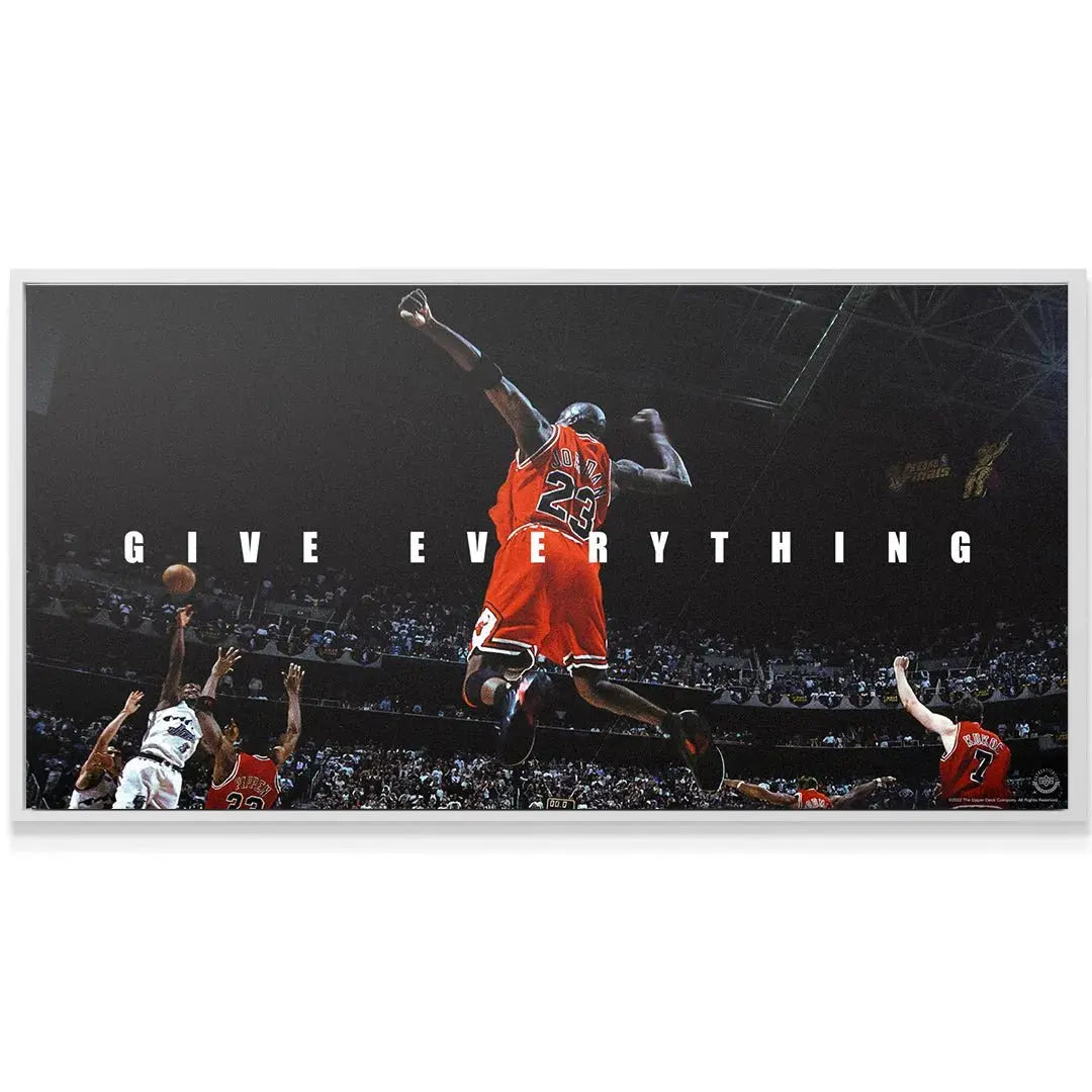 Wide-angle shot showing the dark atmospheric backdrop and bright highlights of the Michael Jordan - Give Everything print.