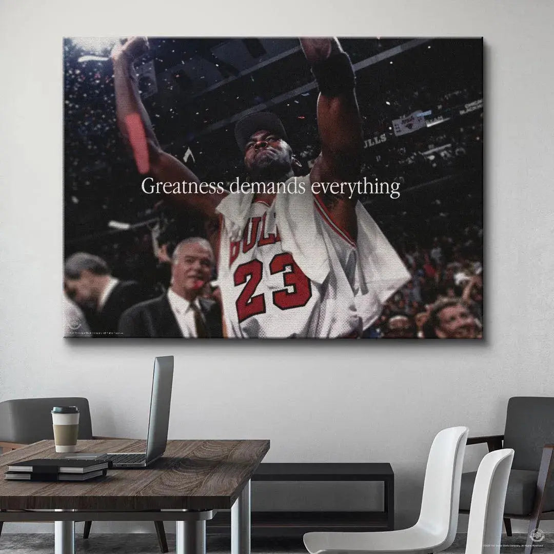 Wide view of the celebratory moment featuring #23 and the quote Michael Jordan - Greatness Demands Everything clearly visible.