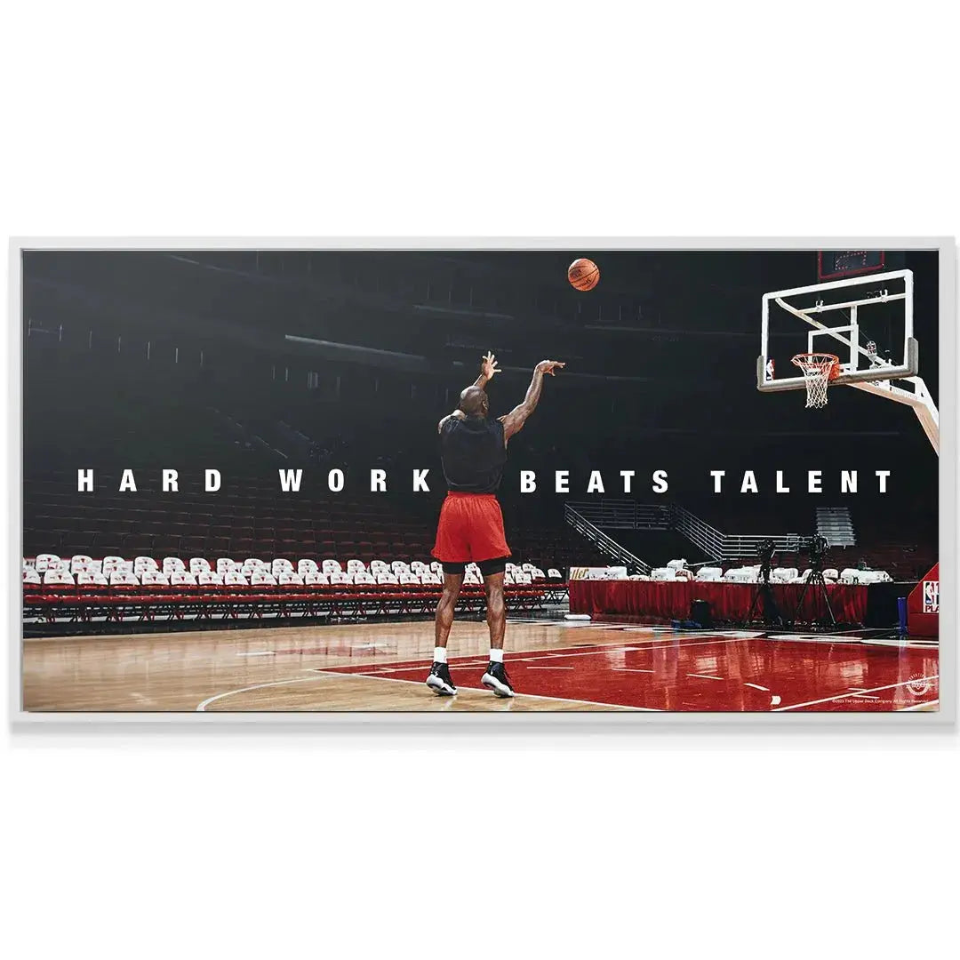 Wide-angle perspective of the empty stadium ambiance emphasizing the profound quote: Michael Jordan - Hard Work Beats Talent.