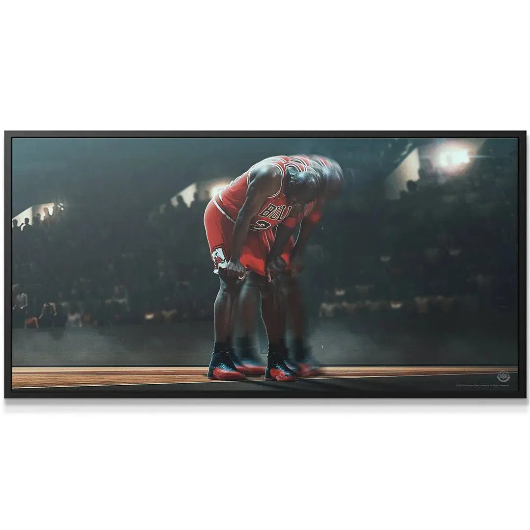 Lifestyle presentation of the framed "Michael Jordan - Keep Going" poster hanging in a modern home gym.