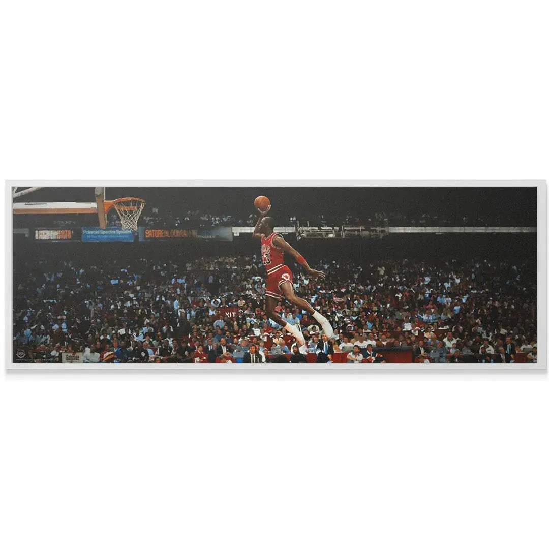 Textured canvas print of Michael Jordan - Mid Flight mounted and ready for display in a modern sports fan's living room.