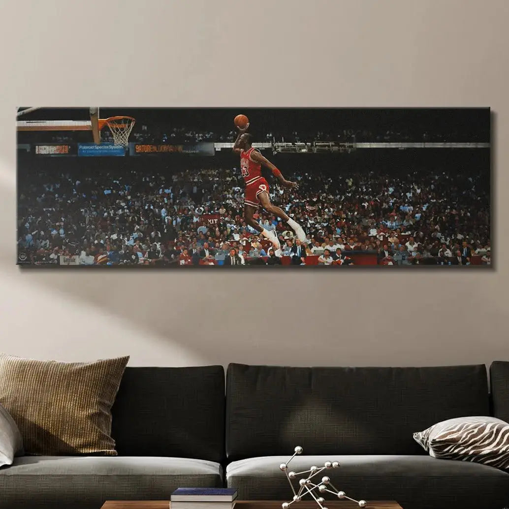 Dramatic low-angle perspective of Michael Jordan - Mid Flight emphasizing his incredible elevation towards the basketball rim.