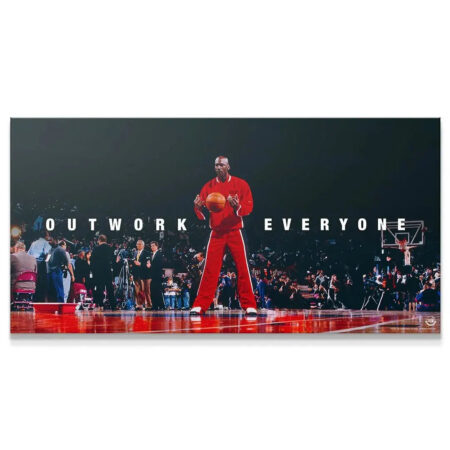 Full horizontal view of the Michael Jordan - Outwork Everyone poster under dramatic stadium lighting.