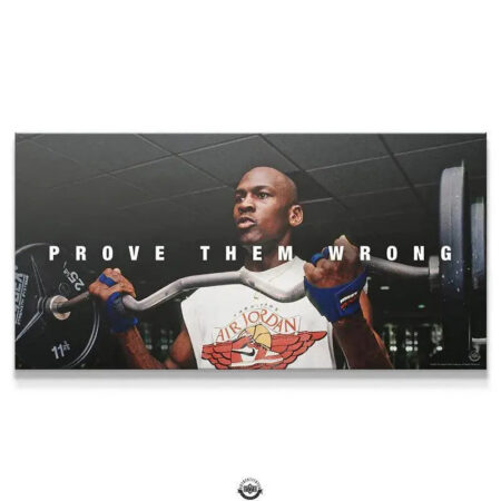 Close-up of Michael Jordan’s determined face while lifting weights in the 'Michael Jordan - Prove Them Wrong' poster.