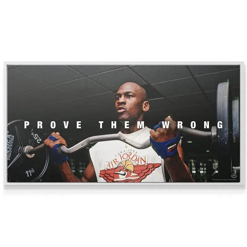 Wide-angle view showcasing the full 'PROVE THEM WRONG' text above Michael Jordan lifting the barbell.