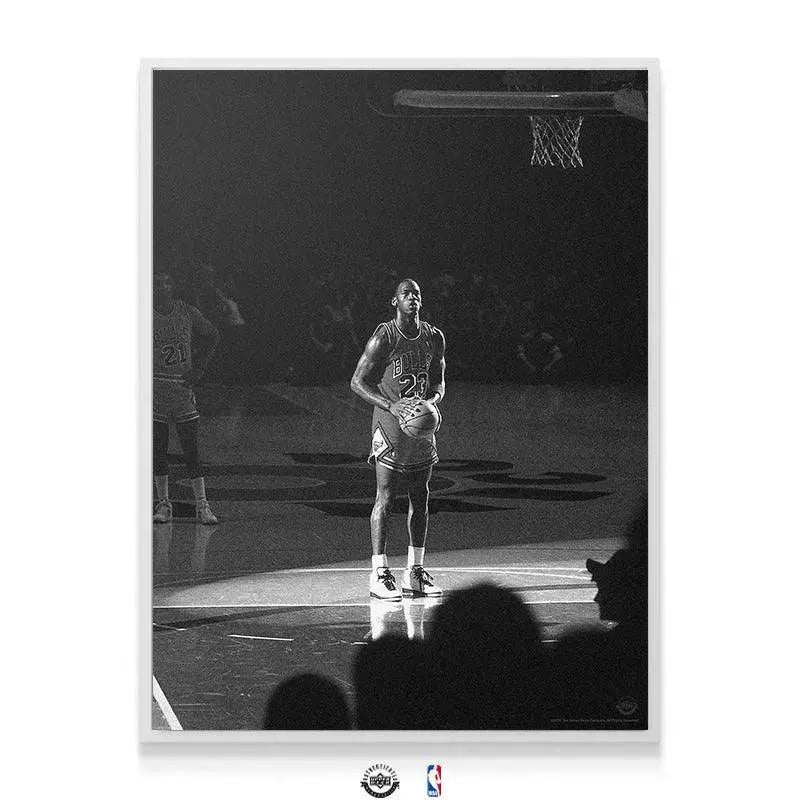Wide-angle view showing the intense court lighting and shadows surrounding Michael Jordan - Spotlight on the court.