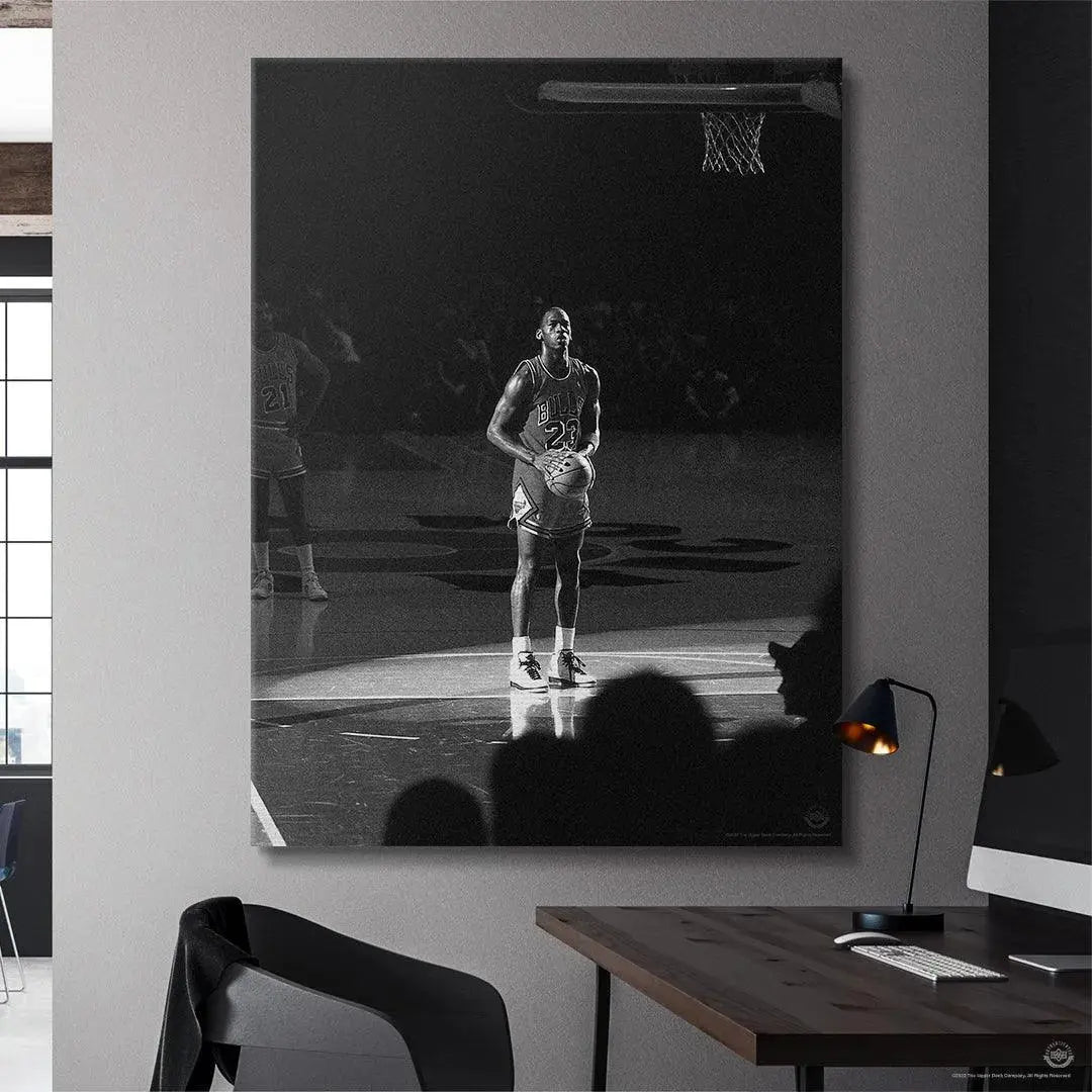 Black and white lifestyle photo of the Michael Jordan - Spotlight canvas artwork mounted on a contemporary wall.