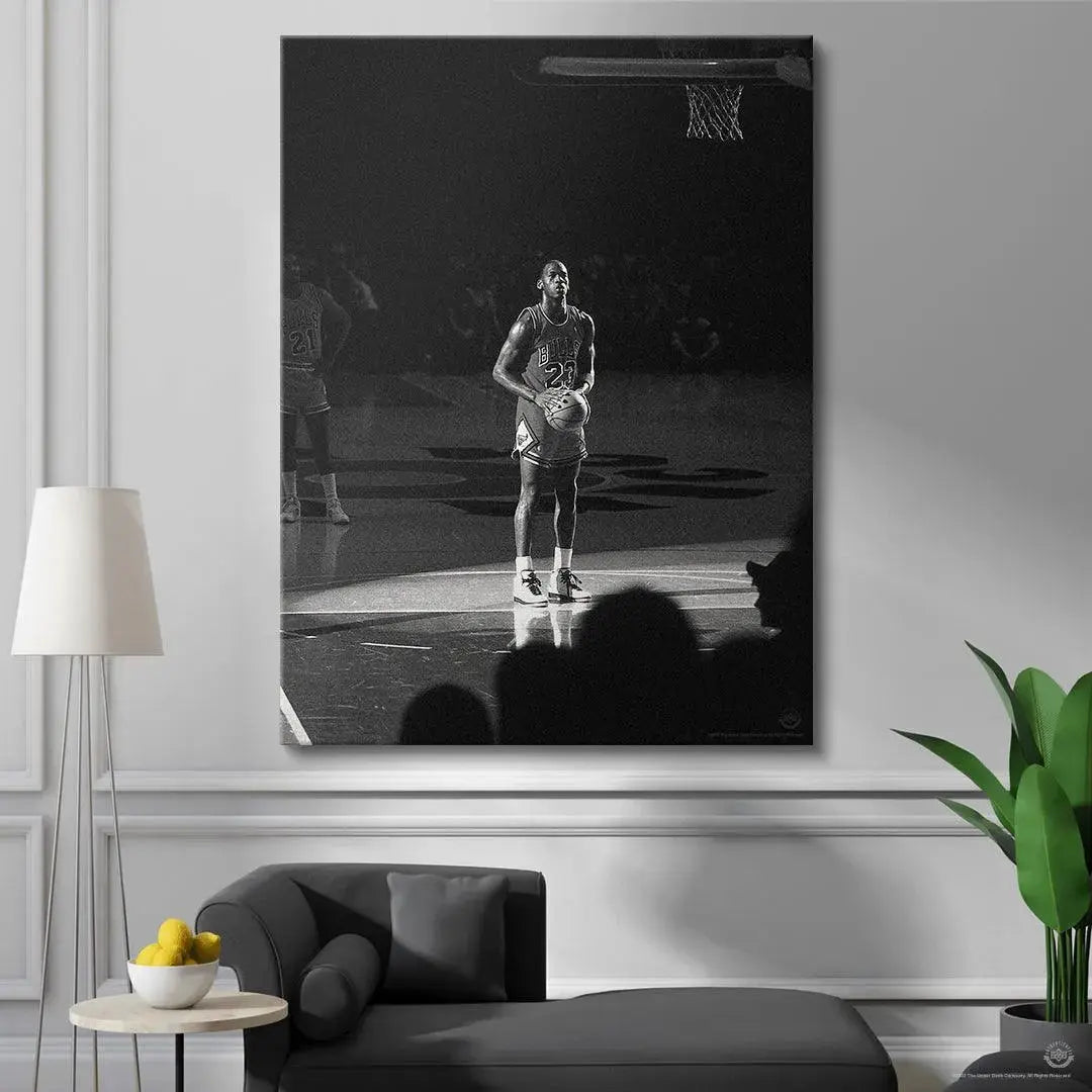 Detailed view of Michael Jordan - Spotlight wearing his iconic Chicago Bulls uniform number 23 captured under bright light.