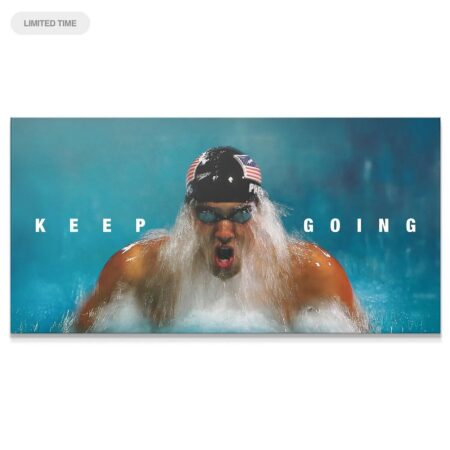 Dynamic close-up of Michael Phelps - Keep Going swimming print showing water splashing texture.
