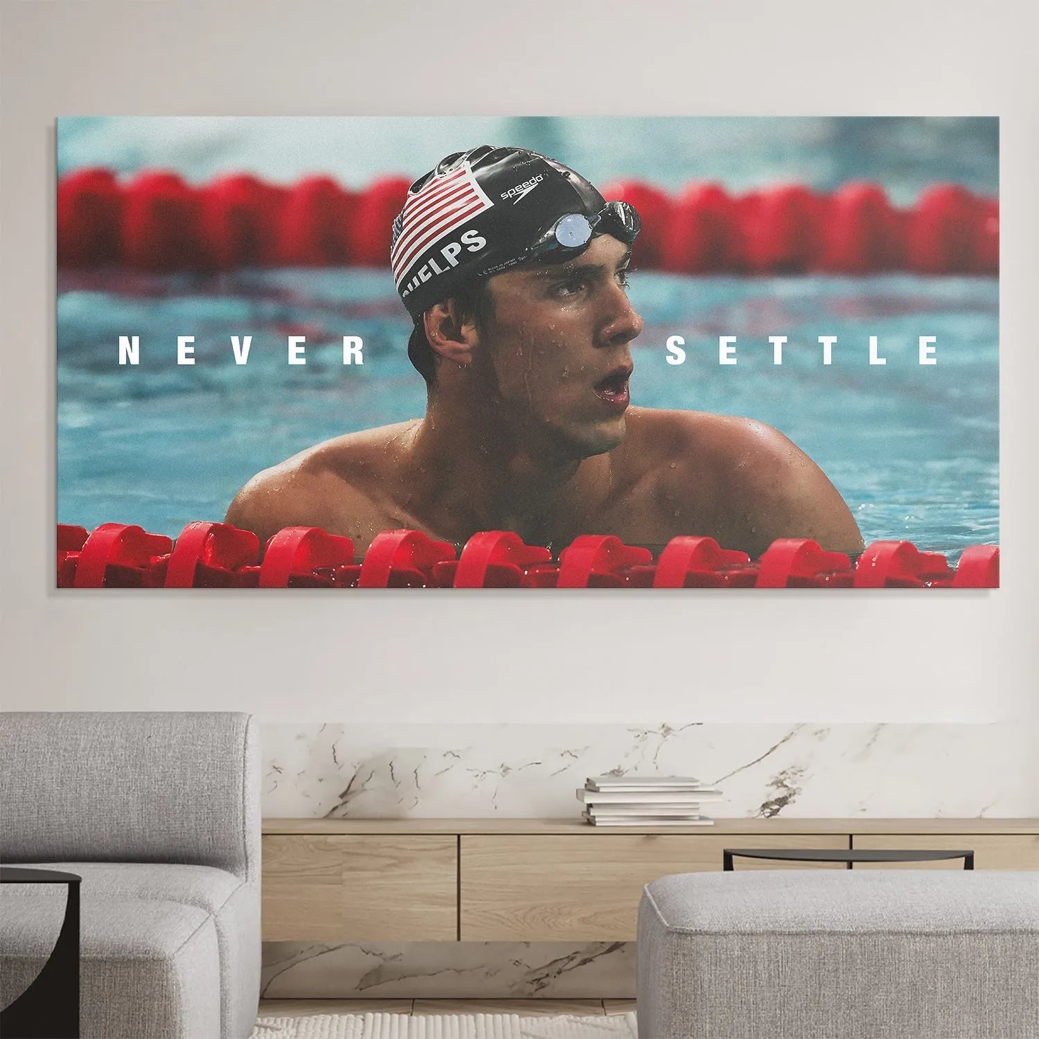 Lifestyle mock-up of the framed wall art 'Michael Phelps - Never Settle' installed in a modern gym.