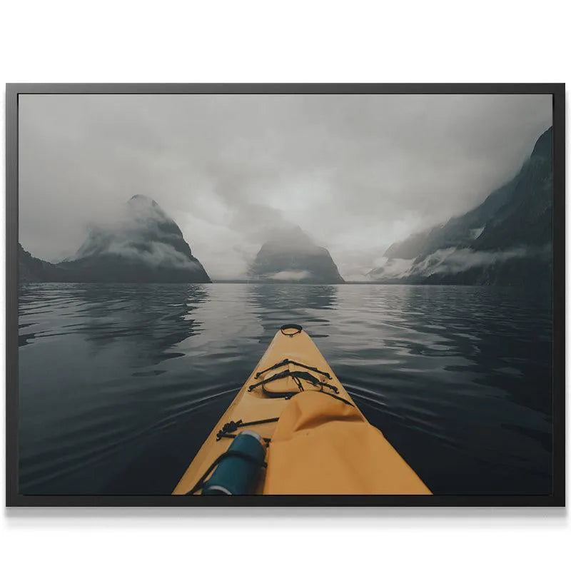 Dramatic overview of dark water and fog-shrouded peaks, emphasizing Milford Paddles adventure