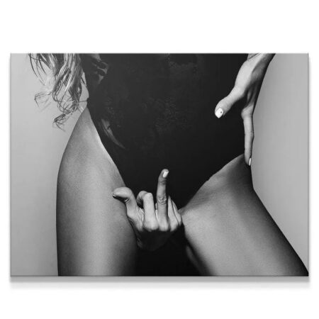 Close-up view of the defiant hand gesture symbolizing 'Mind Your business' in high-contrast black and white.
