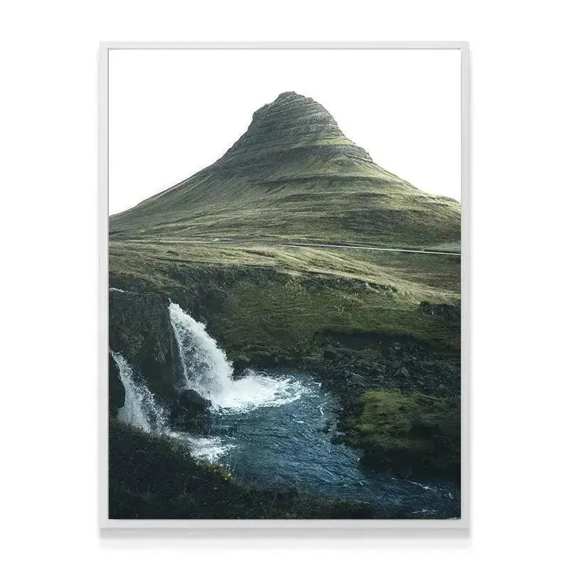 Wide shot showing the stratified green slope texture of Kirkjufell mountain in '(N)iceland'.