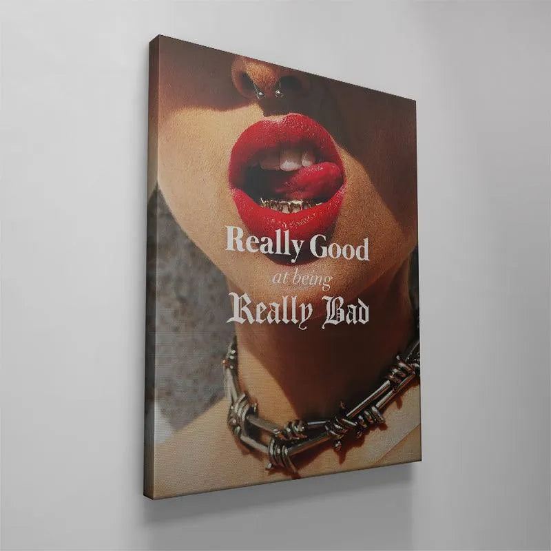 Detailed shot of the septum piercing and tongue near the text "Really Good At Being Really Bad."
