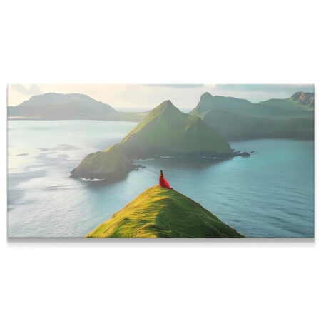 Wide view of woman in flowing Red Dress atop grassy mountain peak, showcasing dramatic scale.