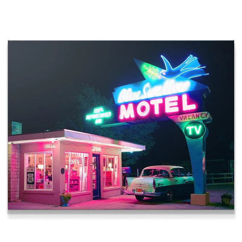 Vintage Blue Swallow Motel at night featuring prominent 'Refrigerated Air' neon sign in vibrant colors.