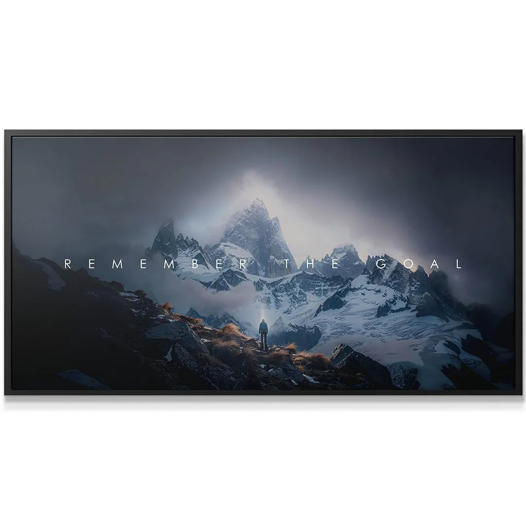 Dark, high-contrast close-up of the central snowy peaks displaying the powerful text: Remember The Goal.