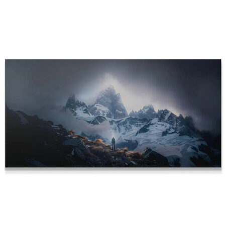 Wide-angle view of snowy peaks and dark clouds, focusing on the small hiker in the foreground: Remember The Goal (No Quote).