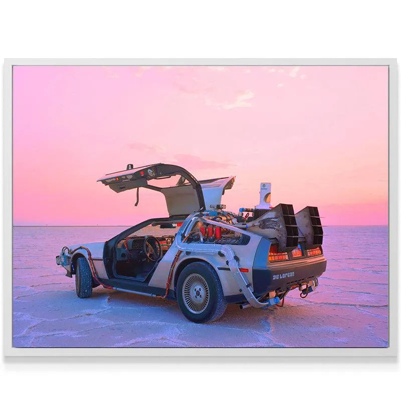 Wide landscape shot of the iconic car under a vibrant pink and purple sunset sky. Roads?