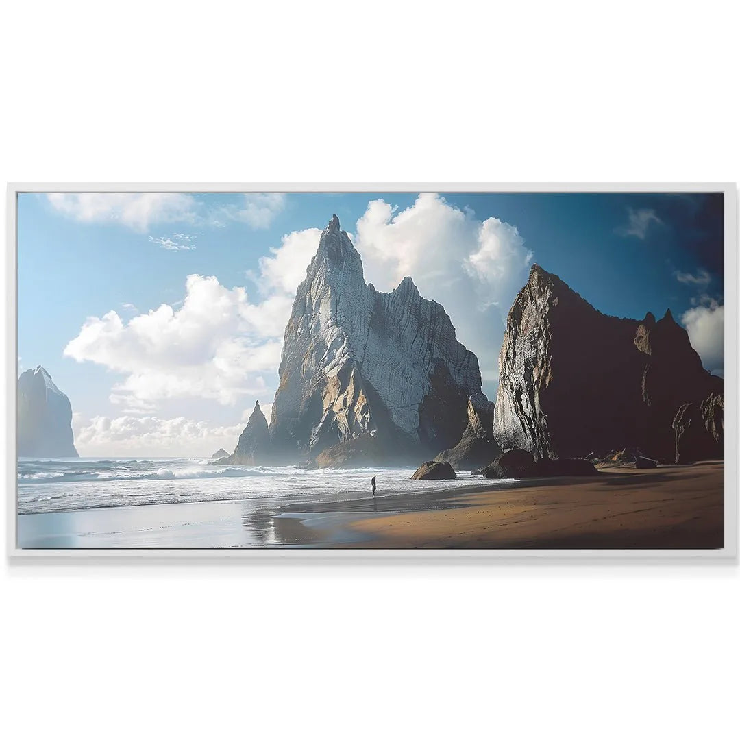 Lifestyle shot showing the canvas art of 'Rocky Beach' mounted above a minimalist sofa.