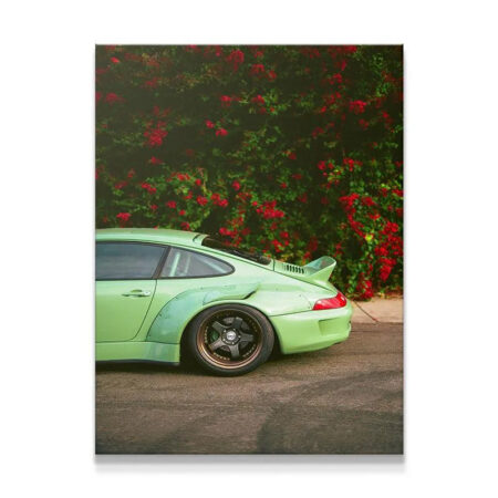 Close-up view of the rear quarter panel and bronze wheel of the light green RWB Bougainville Porsche 911.