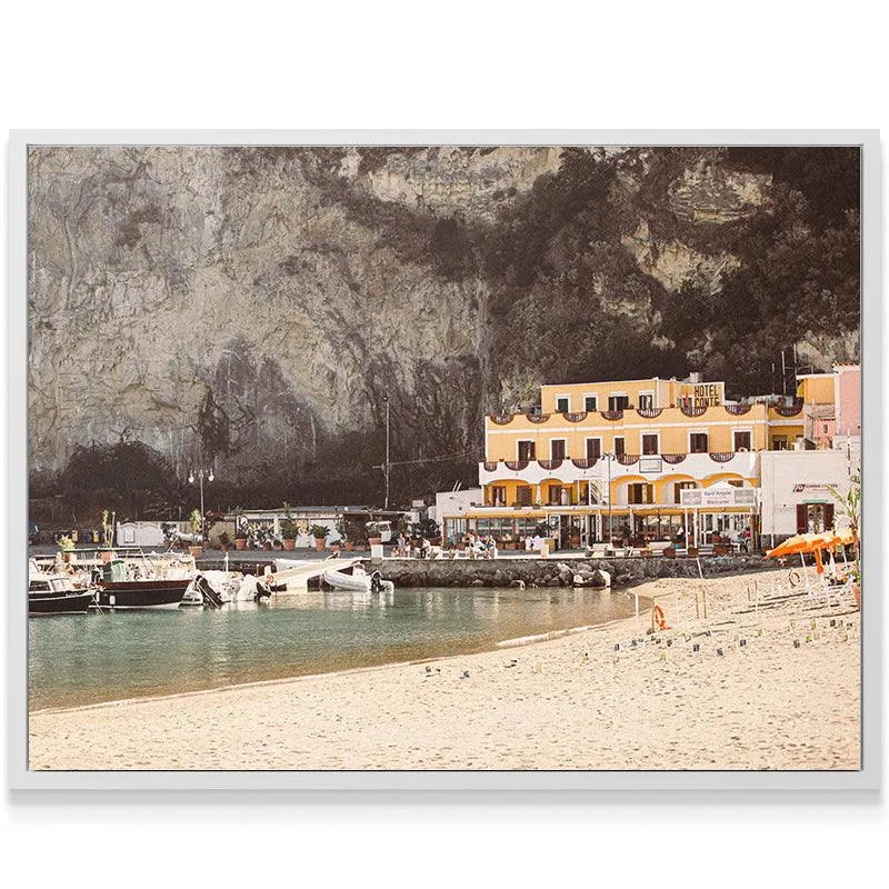 Leisure boats moored in the turquoise waters of the scenic Sant' Angelo marina.