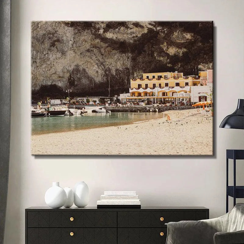 Wide angle shot focusing on the sandy foreground beach leading toward the port of Sant' Angelo.
