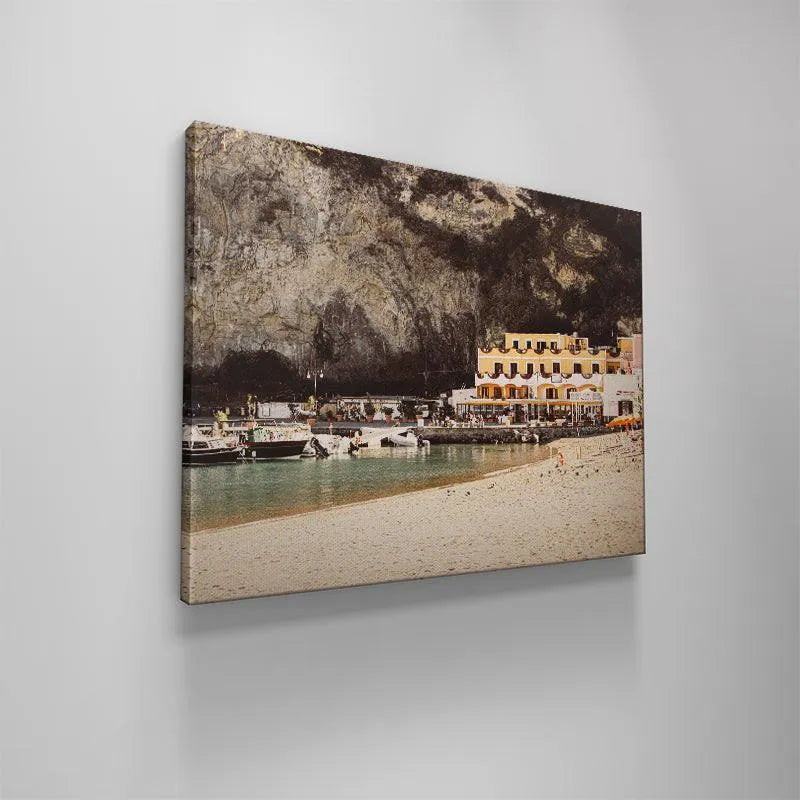 Vertical perspective showcasing the immense height of the cliff overlooking Sant' Angelo's seafront.