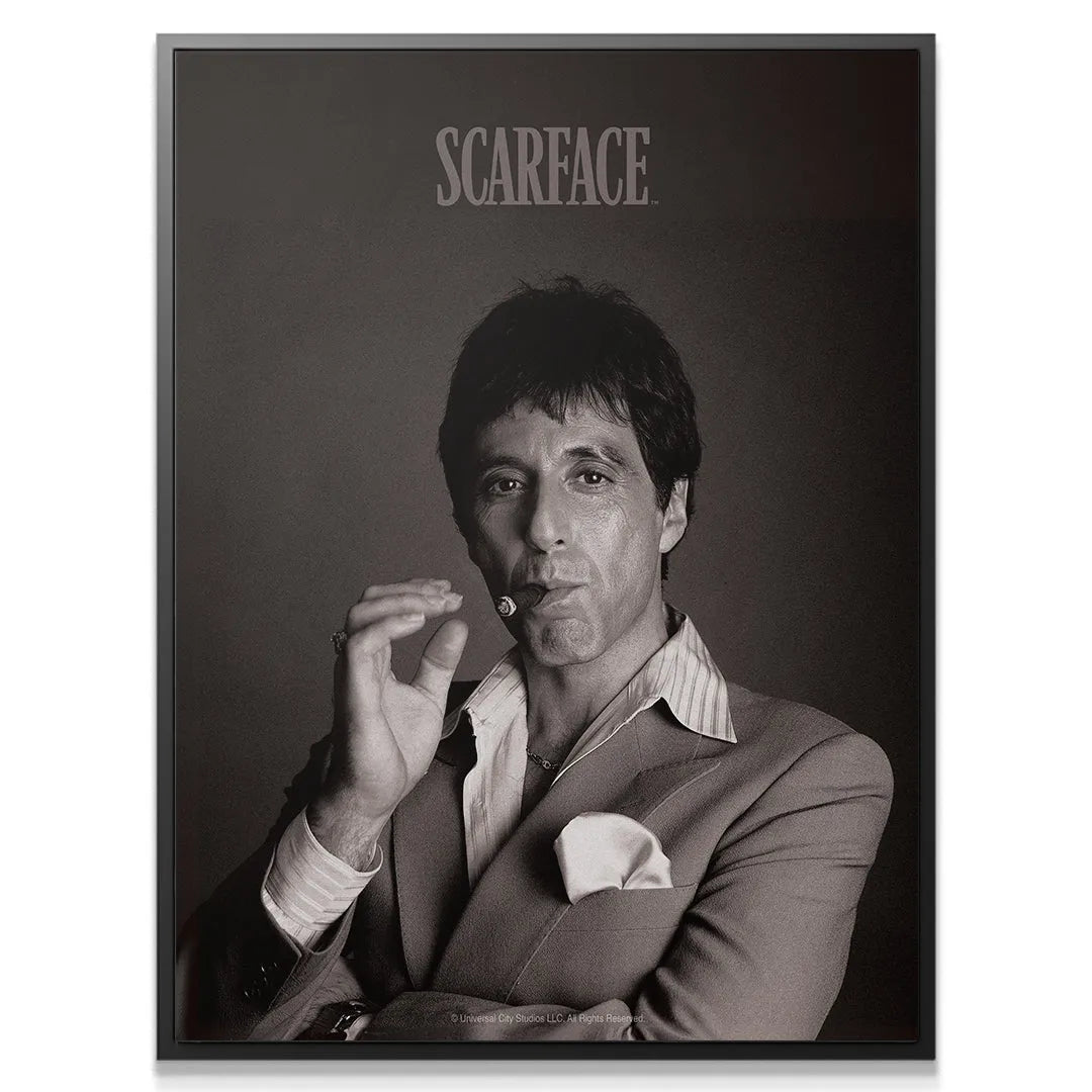 Close-up detail of Tony Montana's intense gaze while holding the iconic Scarface - Cigar.
