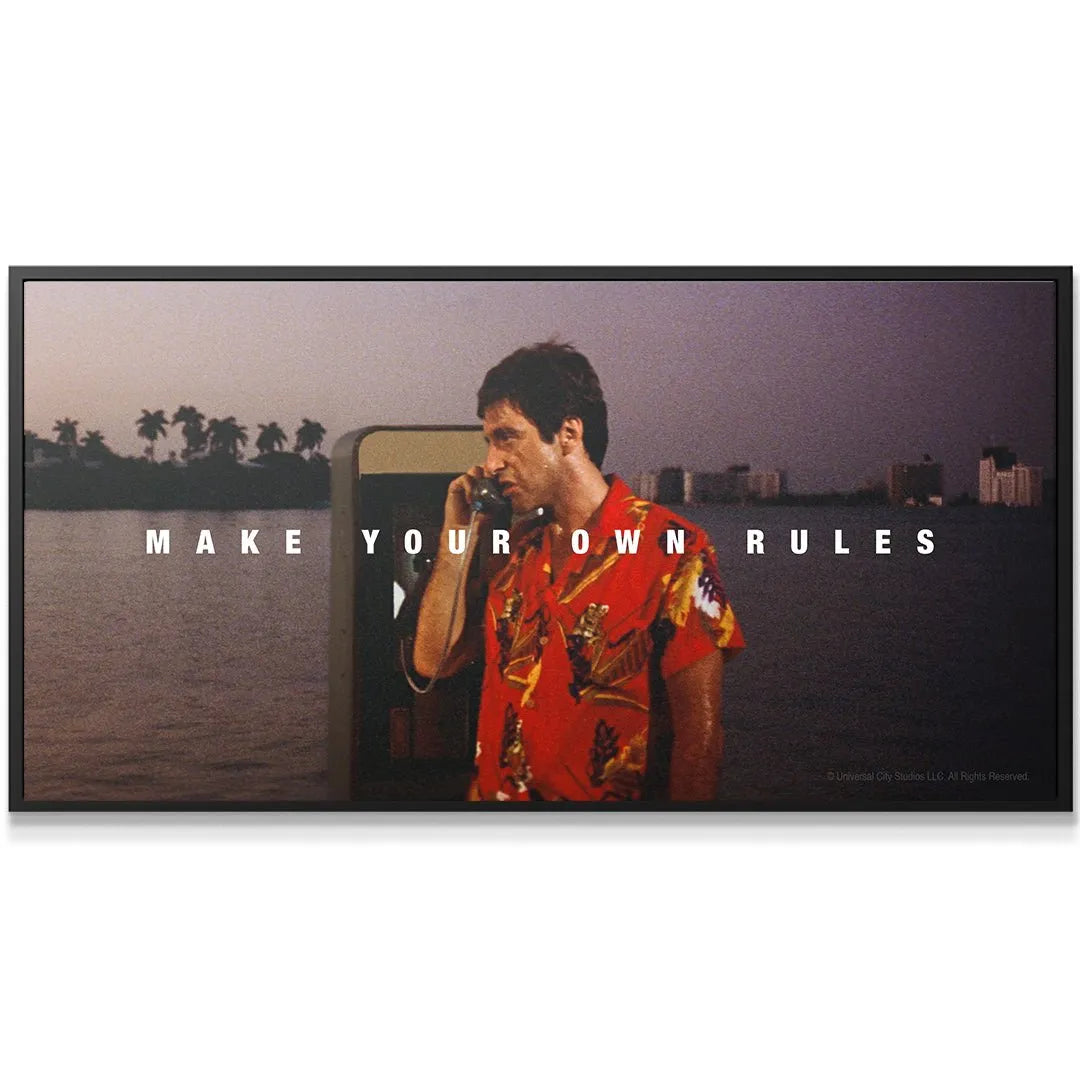 Close-up detail: Tony Montana's intense expression while holding the receiver, highlighting the urgency of 'Scarface - Make Your Own Rules'.