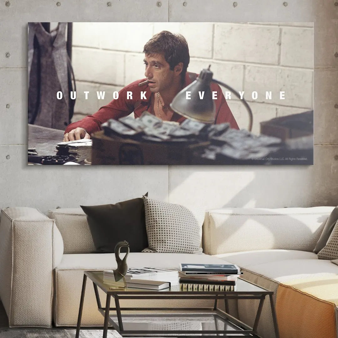 Dramatic lighting highlighting the adjustable desk lamp and the focused, determined expression in the Scarface - Outwork Everyone poster.