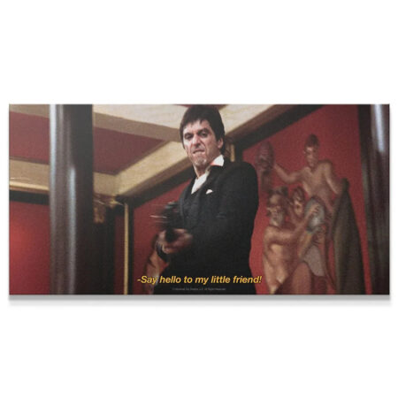 Scarface - Say Hello wide shot showing Tony Montana holding the M16 against the red background mural.